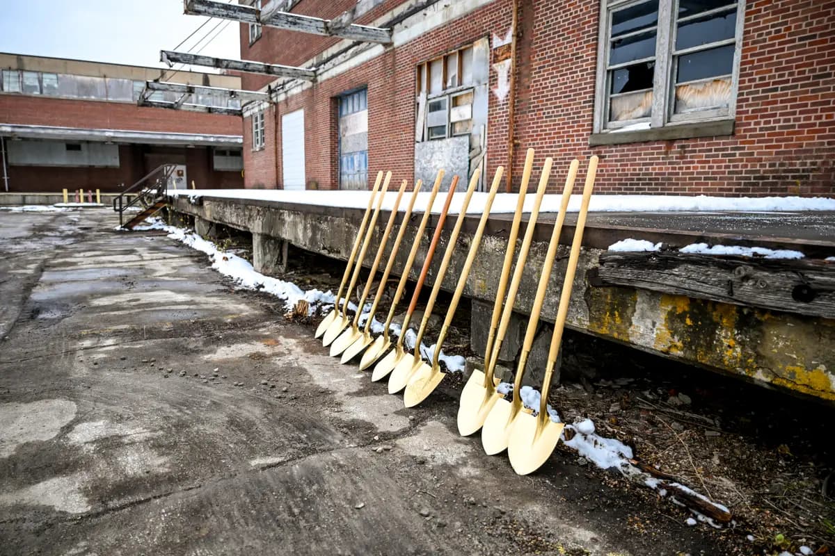 Community members and dignitaries at the podium during opening remarks