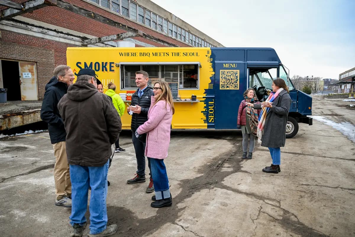 Speaker addressing the crowd at the Historic Northeast Lofts groundbreaking